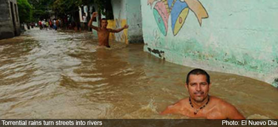 colombia reports - flood street turned river